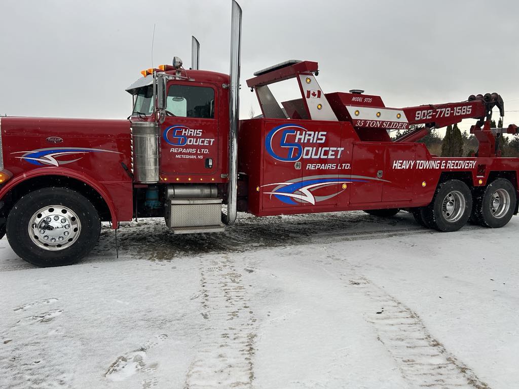Chris Doucet Repairs Ltd heavy towing & recovery truck — side