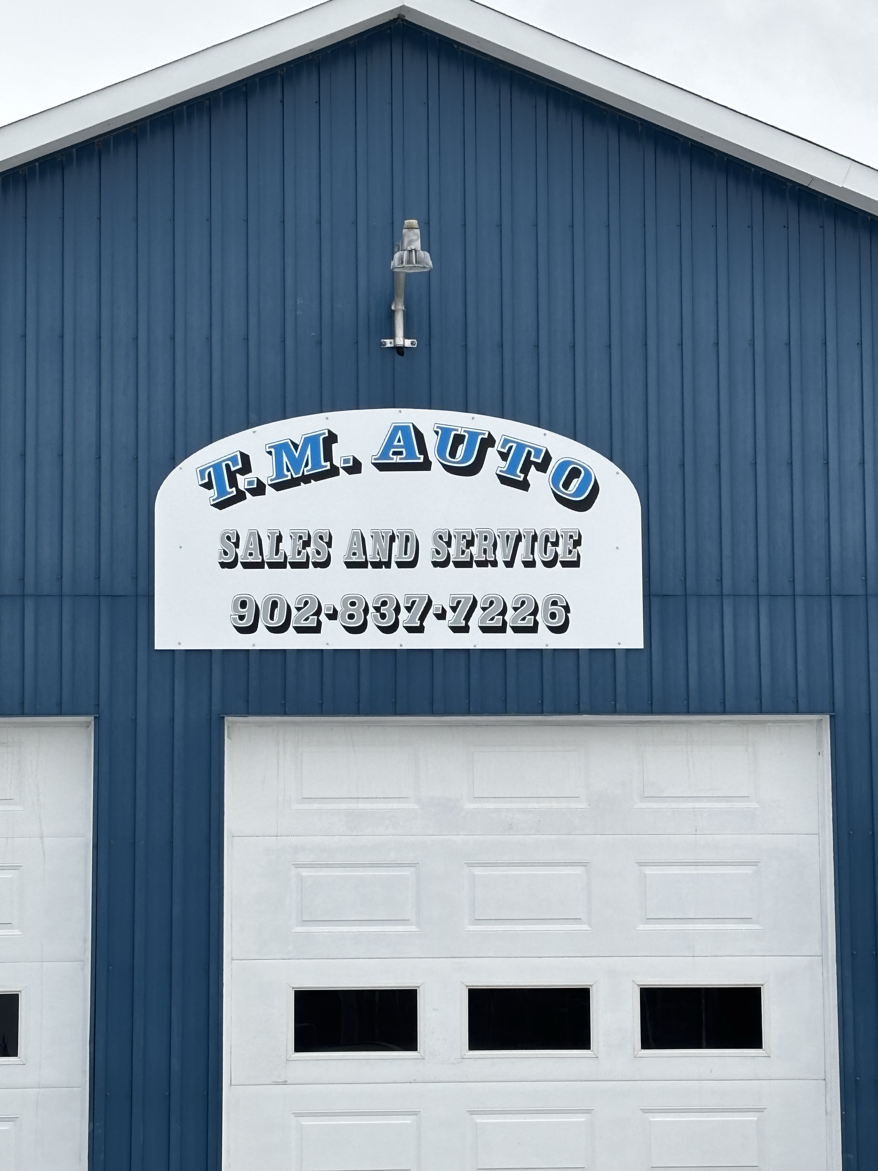 T.M. Auto Sales and Service building sign
